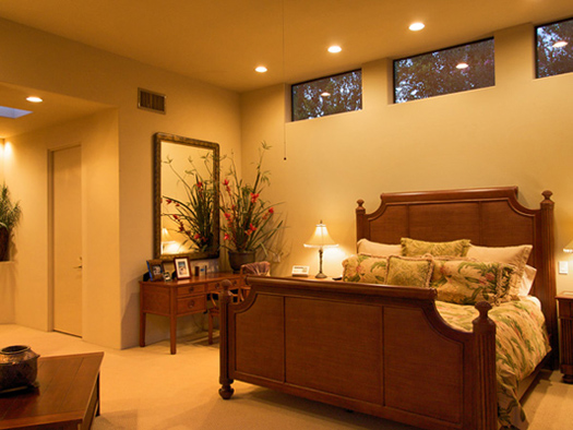 master bedroom suite with flat screen tv 